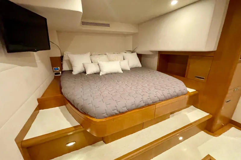 Slide: The Image of Luxurious bedroom interior of 2018 Serenity 64 yacht with cozy bedding and modern design. - 61