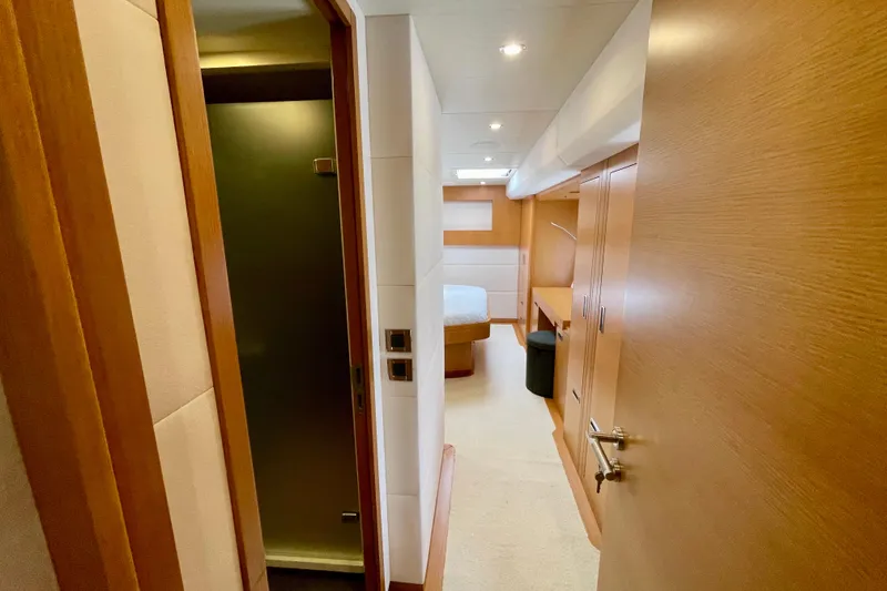 Slide: The Image of Luxurious interior of 2018 Serenity 64 yacht with modern wood finishes and cozy bedroom. - 64