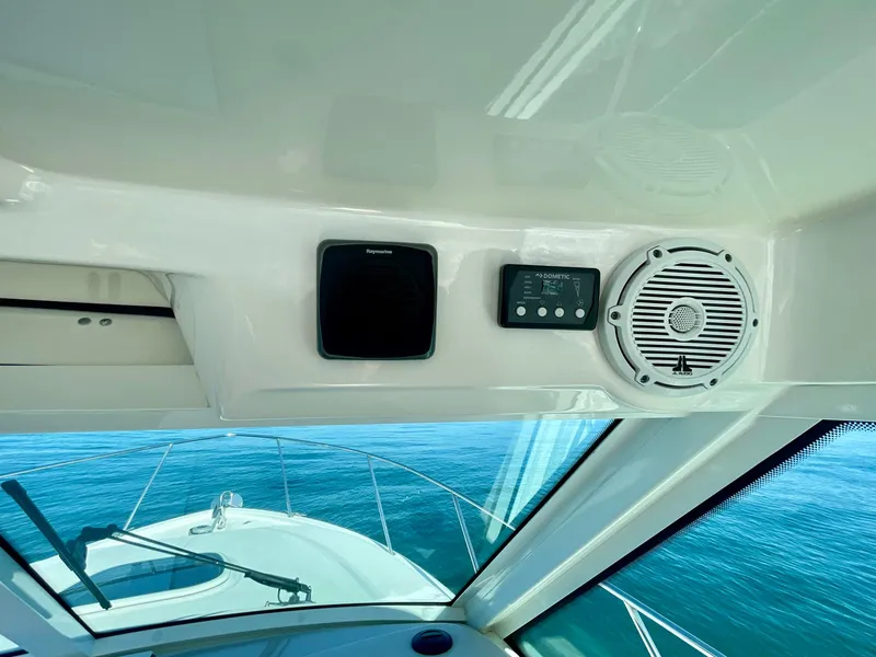 Slide: The Image of 2018 Boston Whaler 315 Conquest helm with navigation equipment and ocean view. - 46