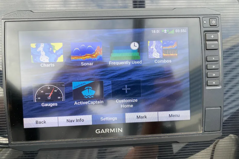 Slide: The Image of Garmin display on 2024 Manitou 22 MAX Explore Navigator Stealth, showing navigation and sonar options. - 14