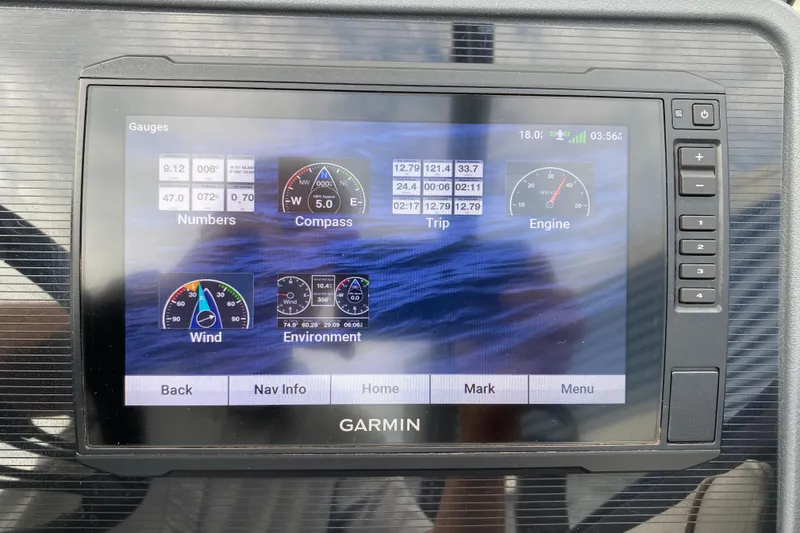 Slide: The Image of Garmin display on 2024 Manitou 22 MAX Explore Navigator Stealth showing navigation and engine data. - 16