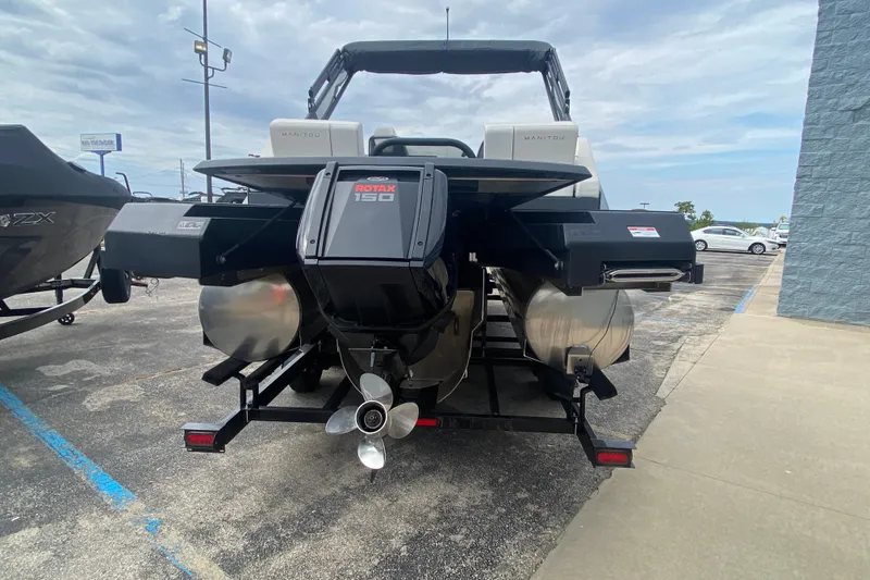Slide: The Image of 2024 Manitou 22 MAX Explore Navigator Stealth with Rotax 150 engine, rear view. - 5