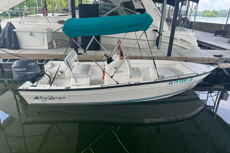 Slide: The Image of 2006 Key Largo 160 Center Console boat docked with Yamaha outboard motor. - 1