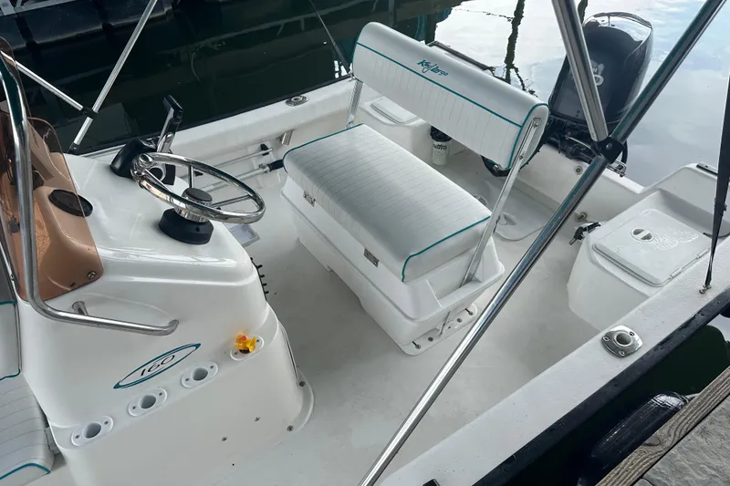 Slide: The Image of 2006 Key Largo 160 Center Console boat interior with steering wheel and seating. - 10