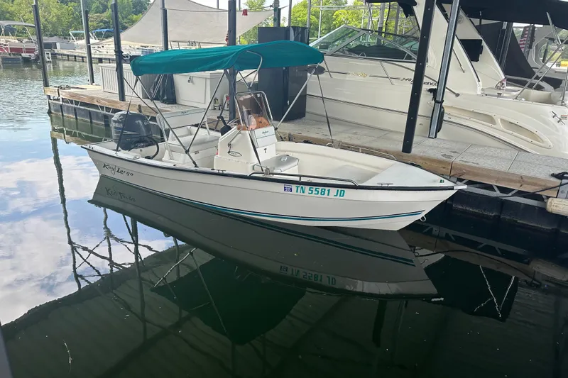 Slide: The Image of 2006 Key Largo 160 Center Console boat docked with green canopy. - 4