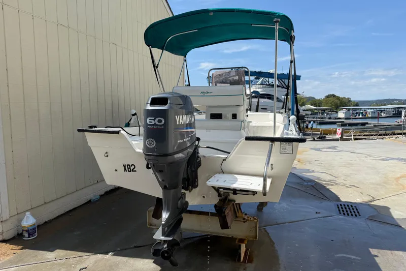 Slide: The Image of 2006 Key Largo 160 Center Console boat with Yamaha 60 outboard motor, docked outdoors. - 7