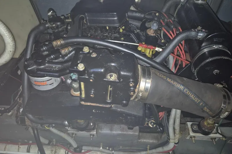 Slide: The Image of Engine compartment of a 1986 Sea Ray 410 Aft Cabin boat, featuring marine exhaust system. - 11