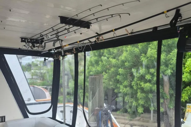 Slide: The Image of Fishing rods stored on a 1986 Sea Ray 410 Aft Cabin boat interior. - 5