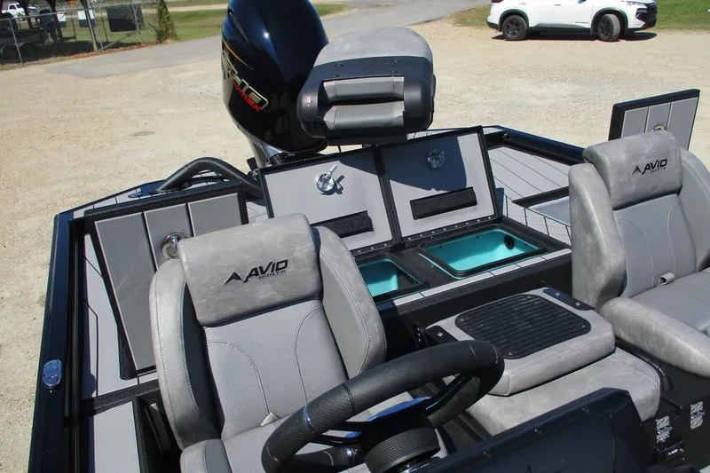 Slide: The Image of 2026 Avid 20 Vertex boat interior with gray seats and modern dashboard. - 11