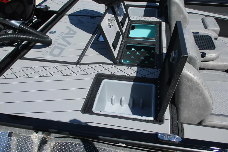 Slide: The Image of 2026 Avid 20 Vertex boat interior with open storage compartments and seating. - 12