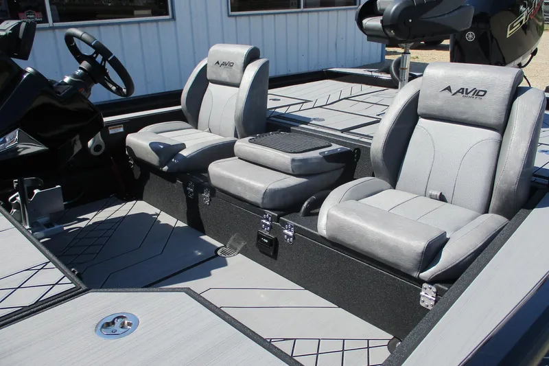 Slide: The Image of 2026 Avid 20 Vertex boat interior with gray seating and modern design. - 14