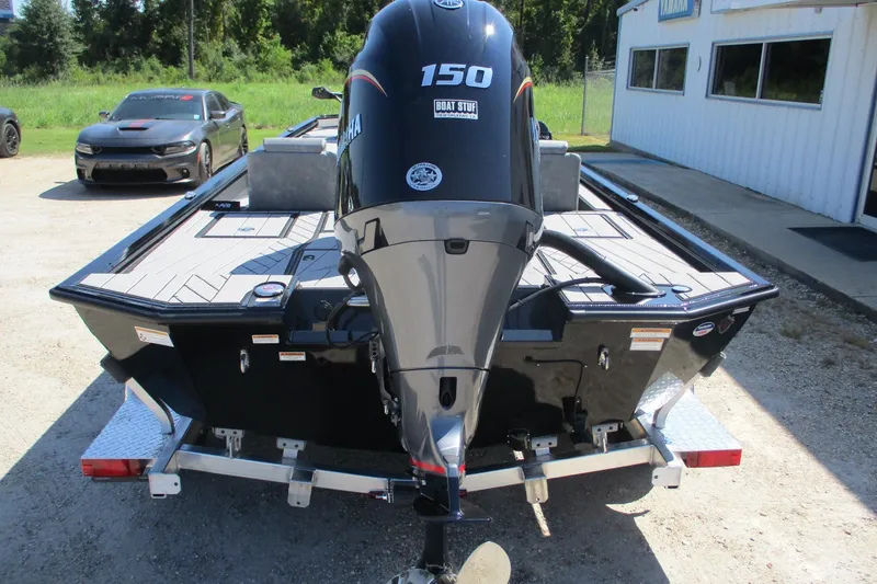 Slide: The Image of Avid 20 Vertex 2026 boat with Yamaha 150 engine on trailer, parked outdoors. - 3