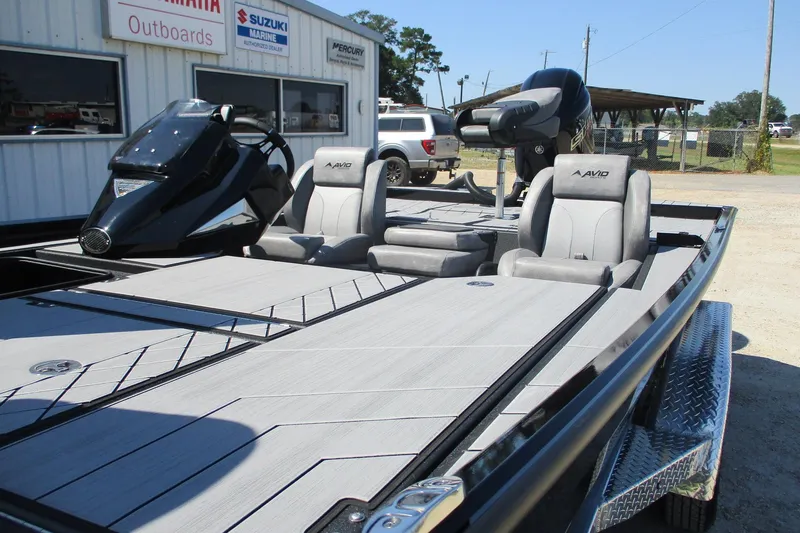 Slide: The Image of 2026 Avid 20 Vertex boat with sleek design and comfortable seating at a dealership. - 4