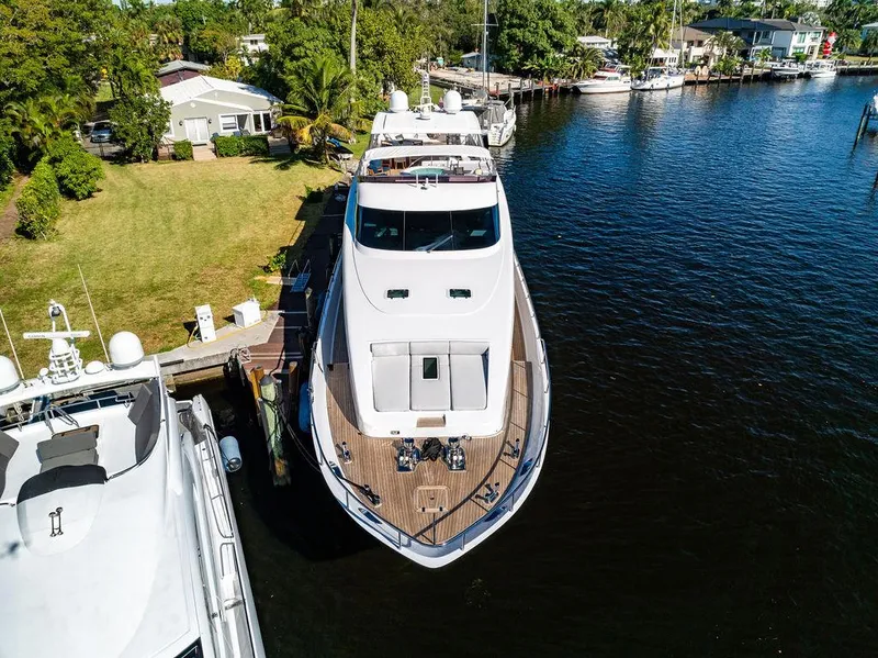 Slide: The Image of Aerial view of 2011 Mengi Yay 115 MY yacht docked by lush greenery. - 11