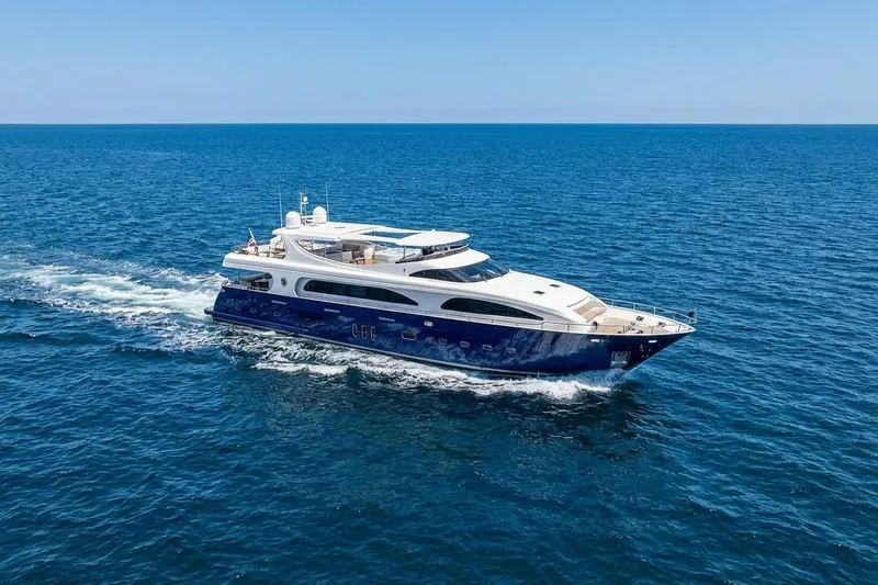 Slide: The Image of Luxurious 2011 Mengi Yay 115 MY yacht cruising on open sea under clear blue sky. - 2