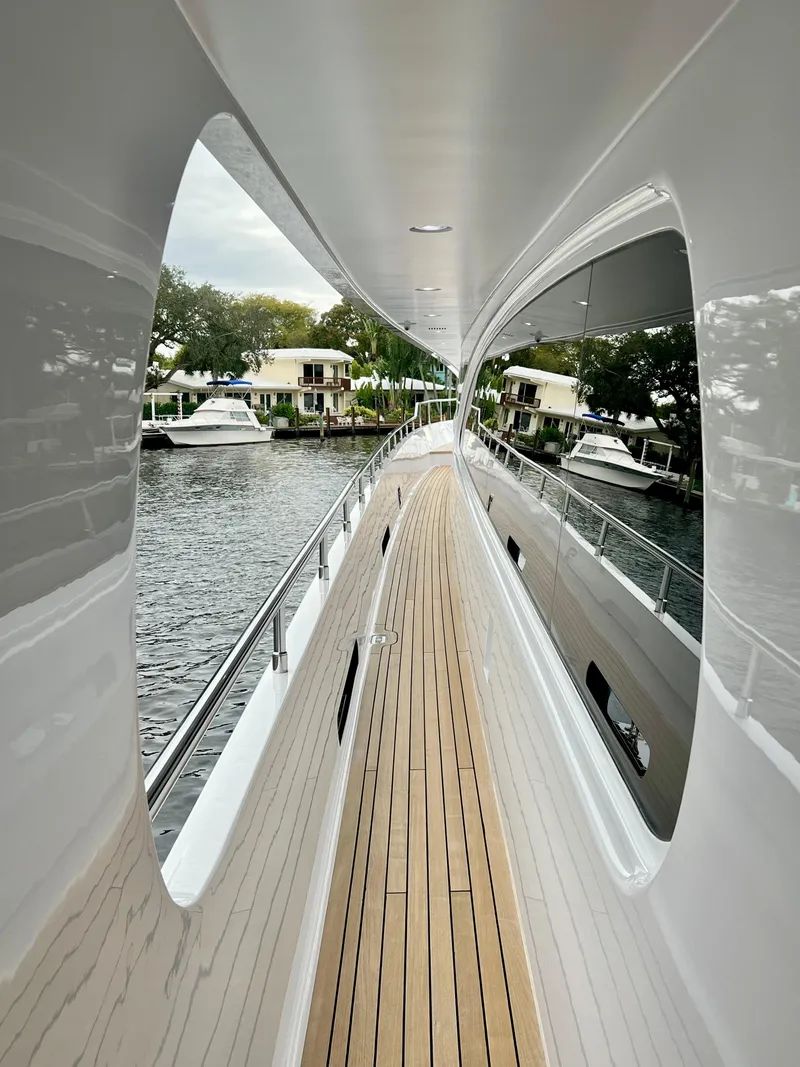 Slide: The Image of Side deck of 2011 Mengi Yay 115 MY yacht with sleek design and waterfront view. - 22