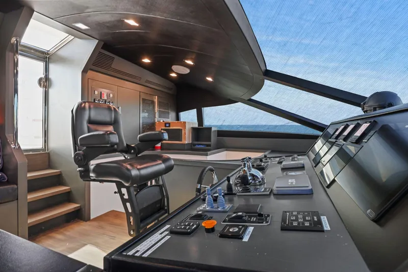 Slide: The Image of Luxurious helm of 2011 Mengi Yay 115 MY yacht with modern controls and captain's chair. - 35