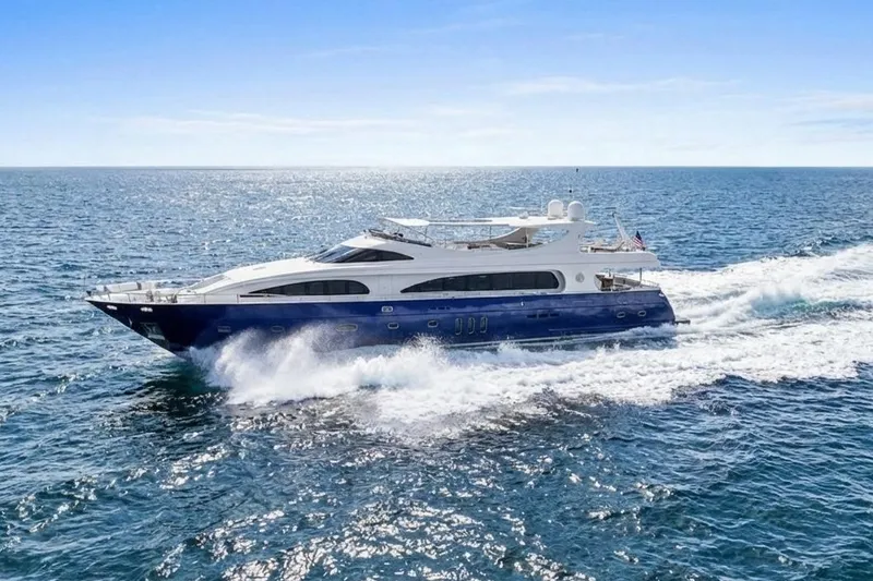 Slide: The Image of Luxurious 2011 Mengi Yay 115 MY yacht cruising on open sea under clear blue sky. - 4