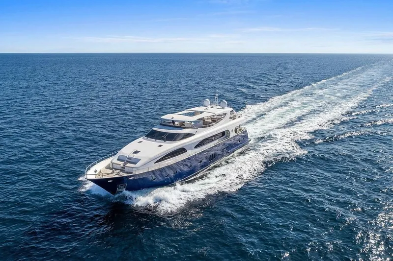 Slide: The Image of Luxurious 2011 Mengi Yay 115 MY yacht cruising on open sea under clear blue sky. - 5