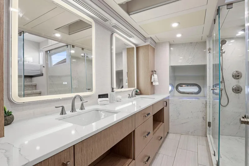 Slide: The Image of Luxurious yacht bathroom with dual sinks, modern fixtures, and glass shower in Mengi Yay 115 MY. - 57
