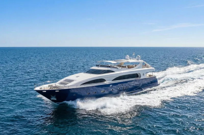 Slide: The Image of Luxurious 2011 Mengi Yay 115 MY yacht cruising on open sea under clear blue sky. - 6