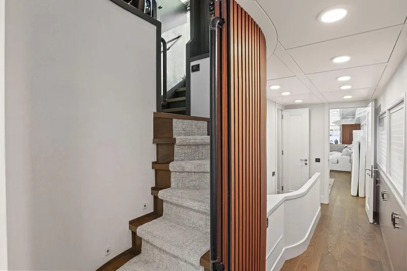 Slide: The Image of Luxurious interior of 2011 Mengi Yay 115 MY yacht with modern staircase and hallway. - 61