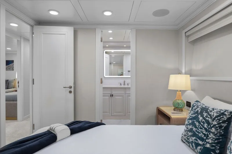 Slide: The Image of Luxurious bedroom interior on 2011 Mengi Yay 115 MY yacht, featuring elegant decor and ambient lighting. - 80