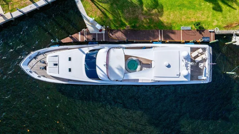 Slide: The Image of Aerial view of 2011 Mengi Yay 115 MY yacht docked by a grassy shore. - 9