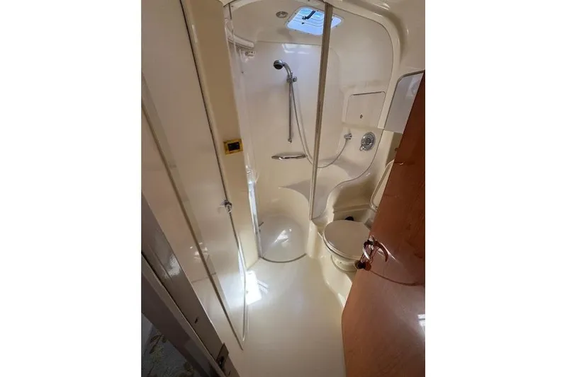 Slide: The Image of Bathroom interior of 2000 Sea Ray 410 Express Cruiser with shower and toilet. - 14