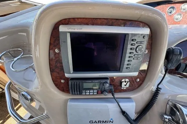 Slide: The Image of Dashboard of 2000 Sea Ray 410 Express Cruiser with Garmin GPS and radio equipment. - 18