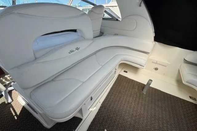 Slide: The Image of Luxurious interior of 2000 Sea Ray 410 Express Cruiser with white leather seating. - 22