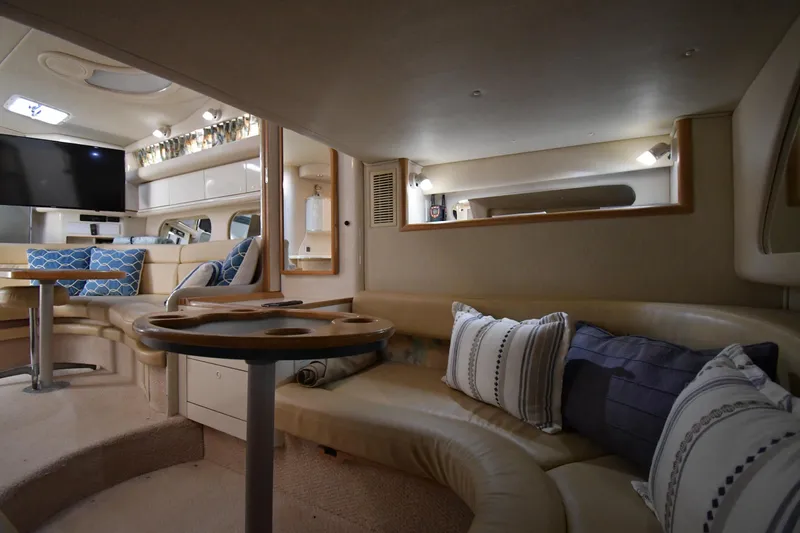 Slide: The Image of Interior of 1995 Sea Ray 370 Sundancer yacht with cozy seating and modern decor. - 48