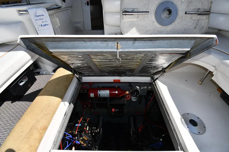 Slide: The Image of Open engine compartment of 1995 Sea Ray 370 Sundancer boat, showing interior components. - 51