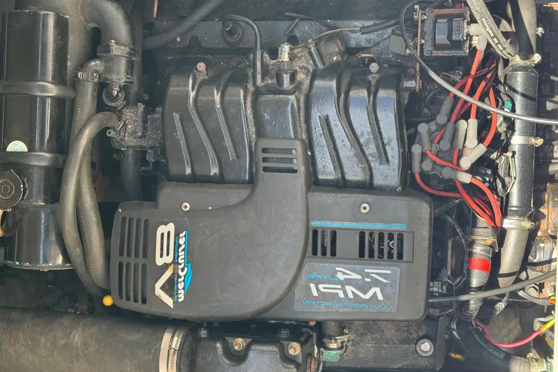 Slide: The Image of Engine of a 1998 Sea Ray 330 Sundancer boat, featuring V8 multi-port injection. - 24