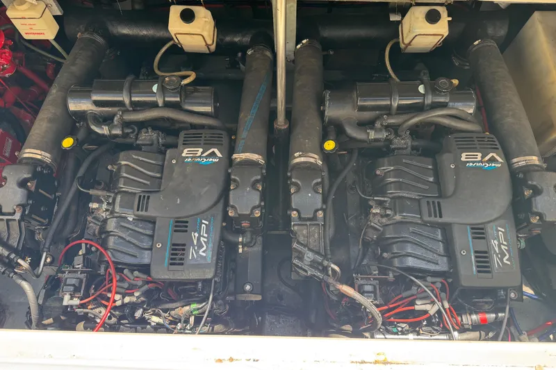 Slide: The Image of Twin MerCruiser V8 engines in a 1998 Sea Ray 330 Sundancer boat. - 27