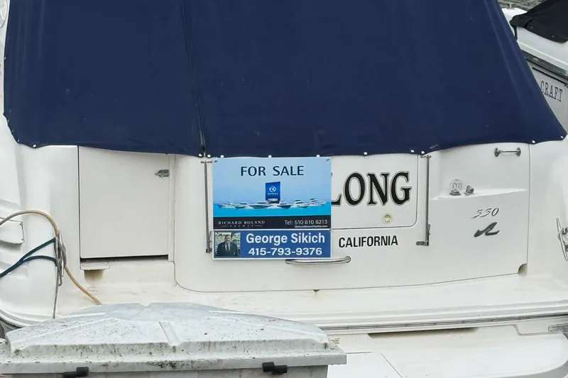 Slide: The Image of 1998 Sea Ray 330 Sundancer boat for sale, contact information displayed. - 28