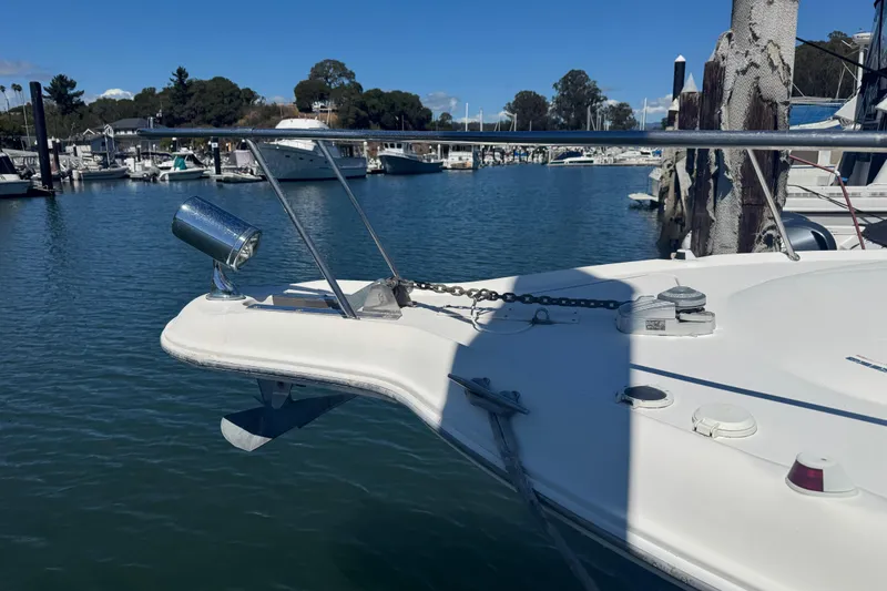 Slide: The Image of 1998 Sea Ray 330 Sundancer docked in a marina under clear blue skies. - 6