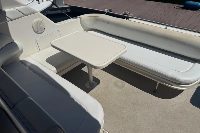 Slide: The Image of 1998 Sea Ray 330 Sundancer boat interior with seating and table. - 8