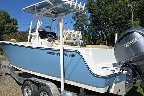 Slide: The Image of 2023 Sportsman Open 242 Center Console boat on trailer with Yamaha engine. - 2