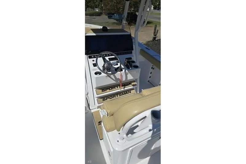 Slide: The Image of 2023 Sportsman Open 242 Center Console boat interior with steering wheel and controls. - 5