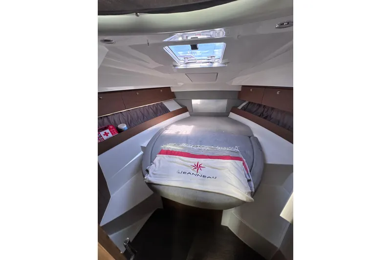 Slide: The Image of Cozy cabin interior of 2019 Jeanneau 895 boat with skylight and bedding. - 8