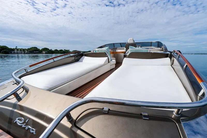 Slide: The Image of Luxurious 2014 Riva Rivarama yacht with spacious sunbeds on calm water. - 14