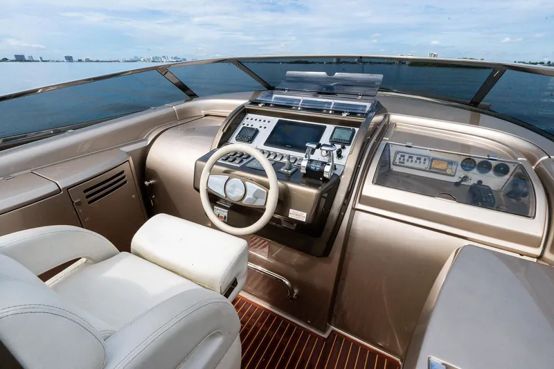 Slide: The Image of 2014 Riva Rivarama yacht cockpit with modern controls and luxurious seating. - 15