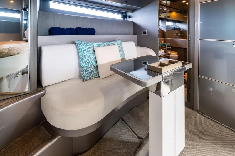 Slide: The Image of Luxurious interior of a 2014 Riva Rivarama yacht with modern seating and table. - 22