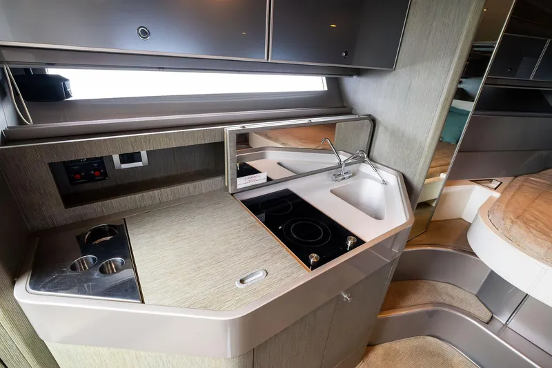 Slide: The Image of Luxurious 2014 Riva Rivarama yacht interior kitchen with modern sink and stovetop. - 24