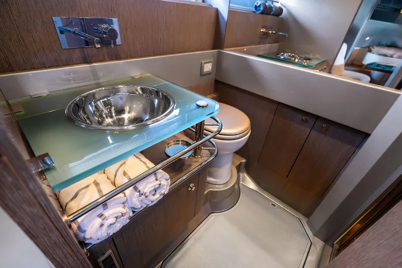 Slide: The Image of Luxurious 2014 Riva Rivarama yacht bathroom with modern sink and elegant wood cabinetry. - 27