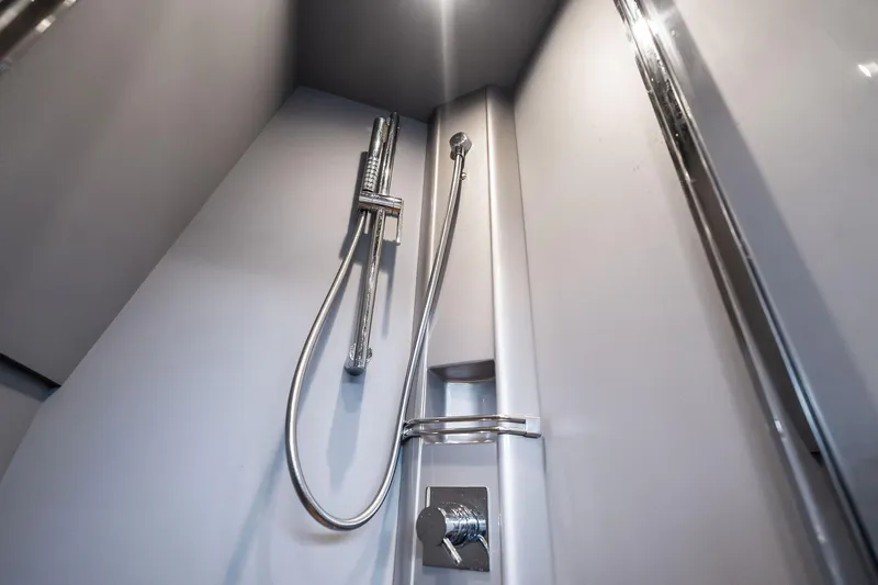 Slide: The Image of Shower area in 2014 Riva Rivarama yacht, featuring modern chrome fixtures. - 30