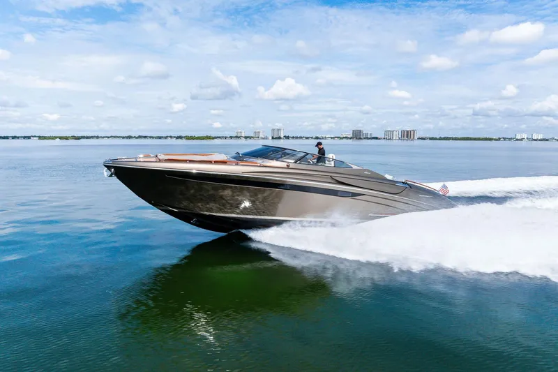 Slide: The Image of 2014 Riva Rivarama luxury yacht cruising on calm waters under a clear sky. - 31
