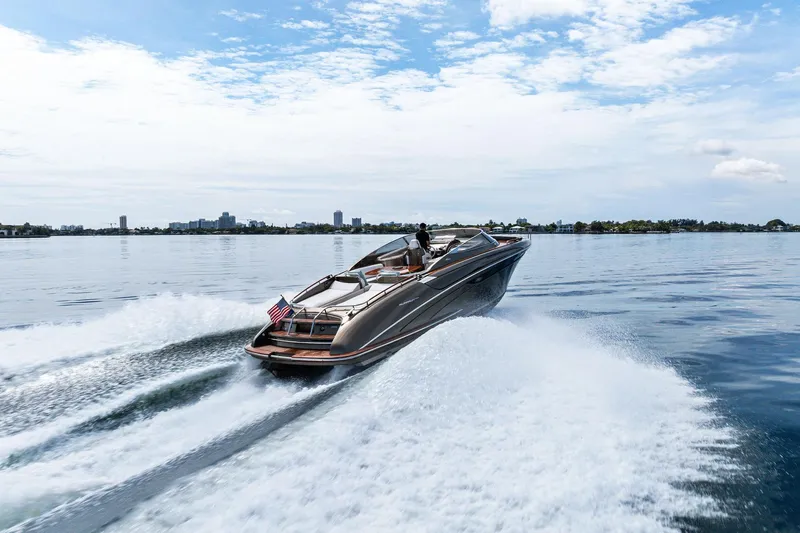 Slide: The Image of 2014 Riva Rivarama luxury yacht cruising on open water, leaving a wake behind. - 32