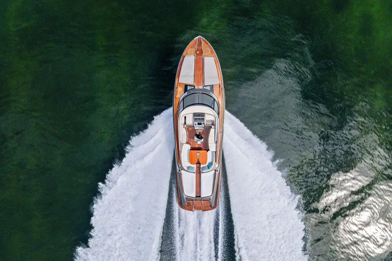 Slide: The Image of Aerial view of 2014 Riva Rivarama luxury yacht cruising on green water. - 34